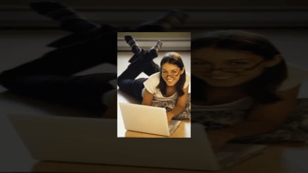 Girl using laptop on floor