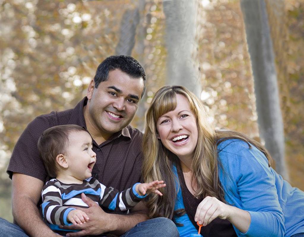 Family reviewing private health insurance plans at home in Garland